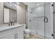 This bright bathroom has a glass-enclosed shower and modern vanity at 2621 Spalding Dr, Las Vegas, NV 89134