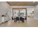 Dining room with contemporary lighting, wood ceilings, and view of the kitchen at 2621 Spalding Dr, Las Vegas, NV 89134