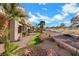 The house exterior shows desert landscaping and a walking path next to the golf course at 2621 Spalding Dr, Las Vegas, NV 89134