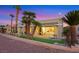 The home's exterior shows a covered patio, desert landscaping, and artificial turf at 2621 Spalding Dr, Las Vegas, NV 89134
