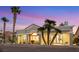 The house exterior features desert landscaping with rocks, artificial turf, and palm trees at 2621 Spalding Dr, Las Vegas, NV 89134