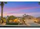 Charming single-story home with a well-manicured lawn, desert landscaping, and a two-car garage at 2621 Spalding Dr, Las Vegas, NV 89134