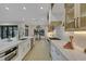 Modern kitchen featuring a central island, stainless steel appliances, and an open layout connecting to the dining area at 2621 Spalding Dr, Las Vegas, NV 89134