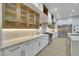 Modern kitchen featuring custom cabinets, stone countertops, and stainless steel appliances at 2621 Spalding Dr, Las Vegas, NV 89134