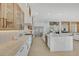 Modern kitchen with glass cabinets, stainless steel appliances, and a large island at 2621 Spalding Dr, Las Vegas, NV 89134