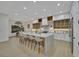 Spacious kitchen with an island featuring barstool seating and open to the dining area at 2621 Spalding Dr, Las Vegas, NV 89134