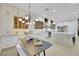 Gourmet kitchen with a large island, modern lighting, white cabinetry, and stainless steel appliances, perfect for entertaining at 2621 Spalding Dr, Las Vegas, NV 89134