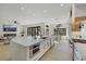 Spacious open-concept kitchen boasts a large island, stainless steel appliances, and seamless flow to the living and dining areas at 2621 Spalding Dr, Las Vegas, NV 89134