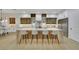 Modern kitchen features a large island with seating, custom cabinets, and stainless steel appliances at 2621 Spalding Dr, Las Vegas, NV 89134