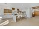 Spacious kitchen boasts an oversized island with seating, custom cabinets, and stainless steel appliances at 2621 Spalding Dr, Las Vegas, NV 89134
