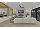 Bright living room featuring a modern fireplace, large sectional sofa, and a view of the backyard at 2621 Spalding Dr, Las Vegas, NV 89134