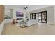 Bright and airy living room with folding glass doors and modern decor at 2621 Spalding Dr, Las Vegas, NV 89134