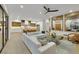 Open floor plan featuring a bright living room and a modern kitchen with a large island at 2621 Spalding Dr, Las Vegas, NV 89134