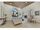 Bright living room featuring a wooden ceiling, arched window, and a modern fireplace at 2621 Spalding Dr, Las Vegas, NV 89134