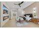 The main bedroom featuring a designer fireplace and modern lighting at 2621 Spalding Dr, Las Vegas, NV 89134
