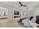 Modern main bedroom featuring an electric fireplace and TV, adjacent bathroom with double vanity sinks at 2621 Spalding Dr, Las Vegas, NV 89134