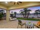 A covered patio features brick pavers and overlooks a golf course and desert landscaping at 2621 Spalding Dr, Las Vegas, NV 89134