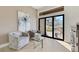 Relaxing sitting area with patio access, plush chairs, stylish furniture, and scenic views at 2621 Spalding Dr, Las Vegas, NV 89134