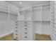 Spacious walk-in closet featuring custom shelves, drawers, and ample hanging space for organized storage at 2621 Spalding Dr, Las Vegas, NV 89134