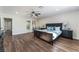 Spacious primary bedroom with a ceiling fan, decorative lamps, and ensuite access at 2909 Gilmary Ave, Las Vegas, NV 89102