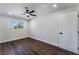 Cozy bedroom with wood floors, a ceiling fan, and a window offering natural light at 2909 Gilmary Ave, Las Vegas, NV 89102
