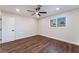Bright bedroom with modern ceiling fan, natural light from the large window, and wood-look flooring at 2909 Gilmary Ave, Las Vegas, NV 89102