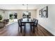 Bright dining room with modern chandelier, patio access, and seating for six at 2909 Gilmary Ave, Las Vegas, NV 89102