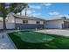 Charming single-story home showcasing a putting green and well-manicured landscaping at 2909 Gilmary Ave, Las Vegas, NV 89102
