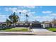 Charming single-story home featuring a putting green and modern garage door at 2909 Gilmary Ave, Las Vegas, NV 89102