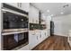 Updated kitchen boasts stainless appliances, stylish backsplash and crisp white cabinetry at 2909 Gilmary Ave, Las Vegas, NV 89102