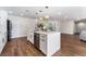 White kitchen island with stainless dishwasher and stylish hardware with an open layout at 2909 Gilmary Ave, Las Vegas, NV 89102