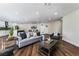 Spacious open-concept living area with hardwood floors connecting the living room and kitchen at 2909 Gilmary Ave, Las Vegas, NV 89102