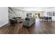 Open-concept living room with fireplace and dining area with stylish decor and hardwood floors at 2909 Gilmary Ave, Las Vegas, NV 89102