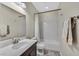 Cozy bathroom with a single sink vanity and a shower-tub combination with a white shower curtain at 3179 Mura Del Prato Ave, Henderson, NV 89044