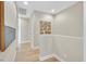 Upstairs hallway with light wood floors and a decorative art piece on the wall at 3179 Mura Del Prato Ave, Henderson, NV 89044