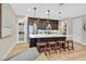 Bright, open kitchen features a large island with bar stools, ample cabinet space, and stainless steel appliances at 3179 Mura Del Prato Ave, Henderson, NV 89044