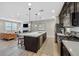 Open-concept kitchen and living area offers a modern island, stainless steel appliances, and seamless entertaining space at 3179 Mura Del Prato Ave, Henderson, NV 89044