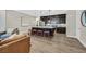 Modern kitchen features a large center island with seating, stainless steel appliances, and dark cabinetry at 3179 Mura Del Prato Ave, Henderson, NV 89044