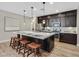 Spacious kitchen island featuring pendant lighting and seating, complemented by modern appliances and ample counter space at 3179 Mura Del Prato Ave, Henderson, NV 89044