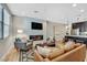 Cozy living room boasts an electric fireplace, a modern TV, and stylish, comfortable seating arrangements at 3179 Mura Del Prato Ave, Henderson, NV 89044