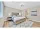 Spacious bedroom with decorative headboard, hardwood floors and recessed lighting at 3179 Mura Del Prato Ave, Henderson, NV 89044