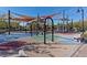 Vibrant playground with swings and sun shades, providing a fun and safe play area at 3179 Mura Del Prato Ave, Henderson, NV 89044
