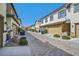 Street view with rows of townhomes, garages, and well-maintained landscaping at 3179 Mura Del Prato Ave, Henderson, NV 89044