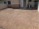 Small gravel back yard with access door and gate for easy yard maintenance at 3208 Regal Swan Pl # 3, North Las Vegas, NV 89084