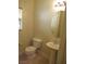 Powder room featuring a toilet and pedestal sink at 3208 Regal Swan Pl # 3, North Las Vegas, NV 89084