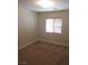Bedroom with a window, neutral walls, and patterned carpet at 3208 Regal Swan Pl # 3, North Las Vegas, NV 89084