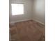 Bedroom with a window, neutral walls, and patterned carpet at 3208 Regal Swan Pl # 3, North Las Vegas, NV 89084