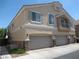 Charming stucco home with three-car garage and manicured landscaping in a residential neighborhood at 3208 Regal Swan Pl # 3, North Las Vegas, NV 89084