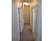 Hallway with doors and carpet at 3208 Regal Swan Pl # 3, North Las Vegas, NV 89084