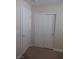 Hallway with doors and carpet at 3208 Regal Swan Pl # 3, North Las Vegas, NV 89084